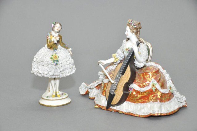 Lot of two antique Dresden lace figures: Lot of two antique Dresden lace figures, consisting of a cello player with unknown mark, and a woman marked Volkstedt. Tallest: 7 1/8"