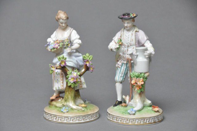Pair of hand painted Carl Thieme figurines: Pair of hand painted Carl Thieme male and female figures with applied flowers. H: 7 1/2" (each)
