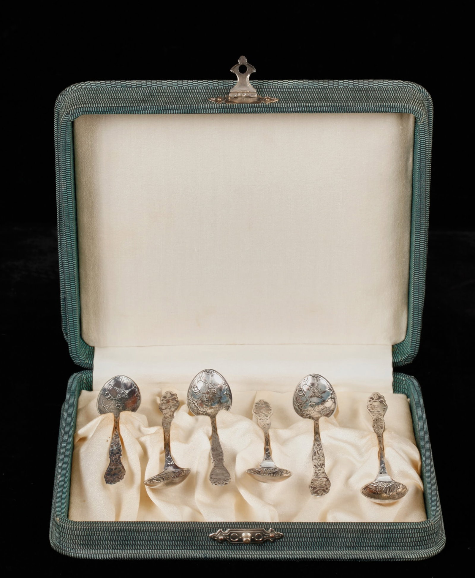 (6) PAYE & BAKER STERLING DEMI TASSE SPOONS: Each embossed and engraved with dogwood blossom motifs. Presented in its original fitted case. 6 x 7 1/4 inches. 1.24 troy ounces