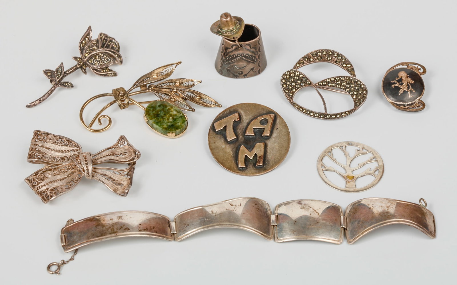 VARIED GROUP of STERLING SILVER JEWELRY: Including: (2) Filigree brooches, Ella Cone sterling "Tam" pin etc. 2.18 troy ounces
