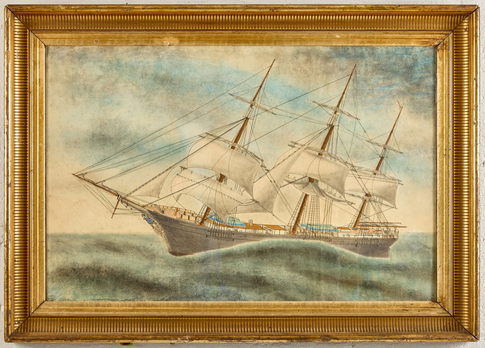 AMERICAN SCHOOL: Clipper Ship Under Sail Watercolor and Ink on paper 18 x 28 inches. Presented in a lemon gold frame Condition: Good, Light foxing Temp No 5062