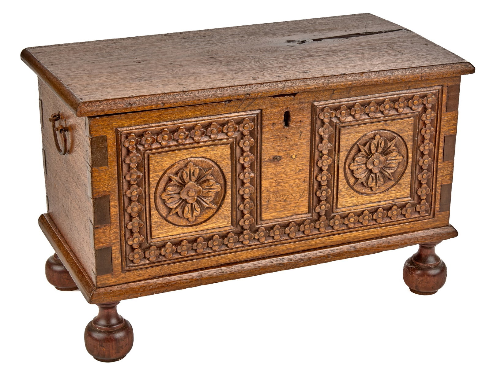 DIMINUTIVE JACOBEAN STYLE CARVED MAHOGANY CHEST: Early (19th c) European mahogany chest with dovetail construction, inner till, carved Tudor rosette panels & border, raised on bun feet. 16 x 24 1/2 x 13 1/4 inches.
