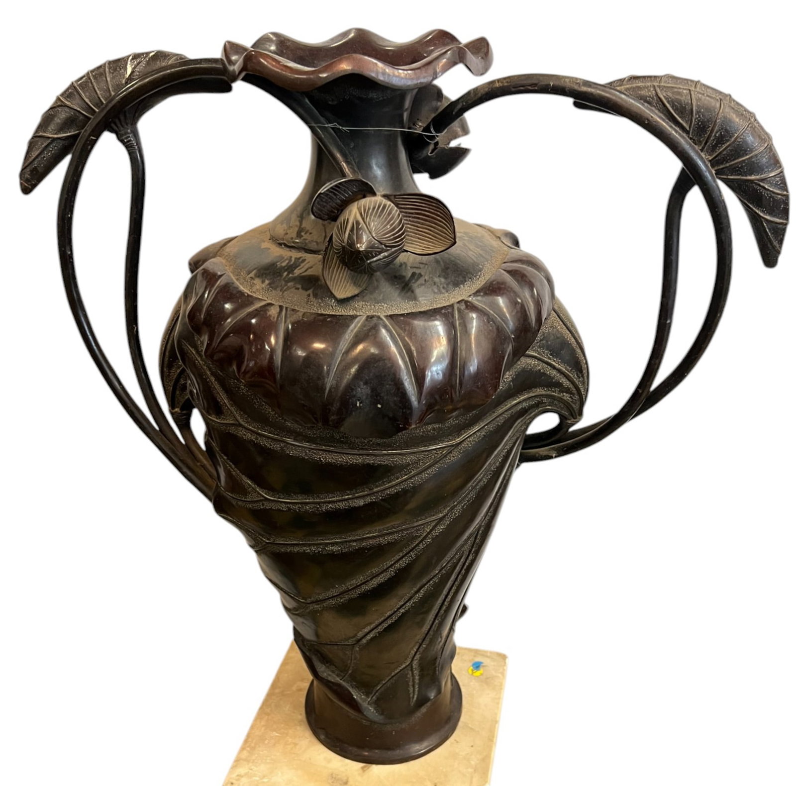 SIGNED JAPANESE MEIJI PERIOD BRONZE LOTUS VASE: A beautiful Meiji period bronze vase with a lotus leaf form body & lotus blossom/pod form handles. Signed in character at base. 29 x 26 x 12 inches. Condition: Possible repair to neck, handles loose. 