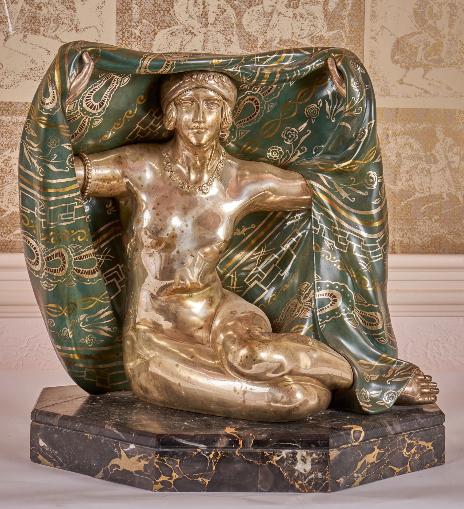 MAURICE GUIRARD RIVIERE (1881-1947): Classic Art Deco bronze sculpture of a nude woman seated holding a shawl above her head. Mounted to an original black marble base. Signed (2) times on back side base, "Etling Paris" gallery signature