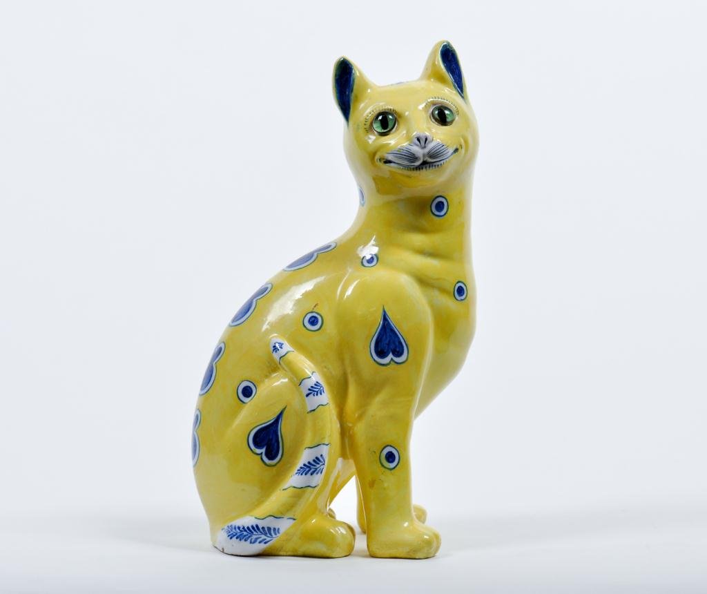 Galle Faience Cat w/ Glass Eyes: Vivid yellow faience cat with deep blue decoration signed "E. Galle, Nancy" with remnants of paper label Condition: good, small flake at base tail Size: 12 3/4" h.good, small flake at base tail12 3/4"