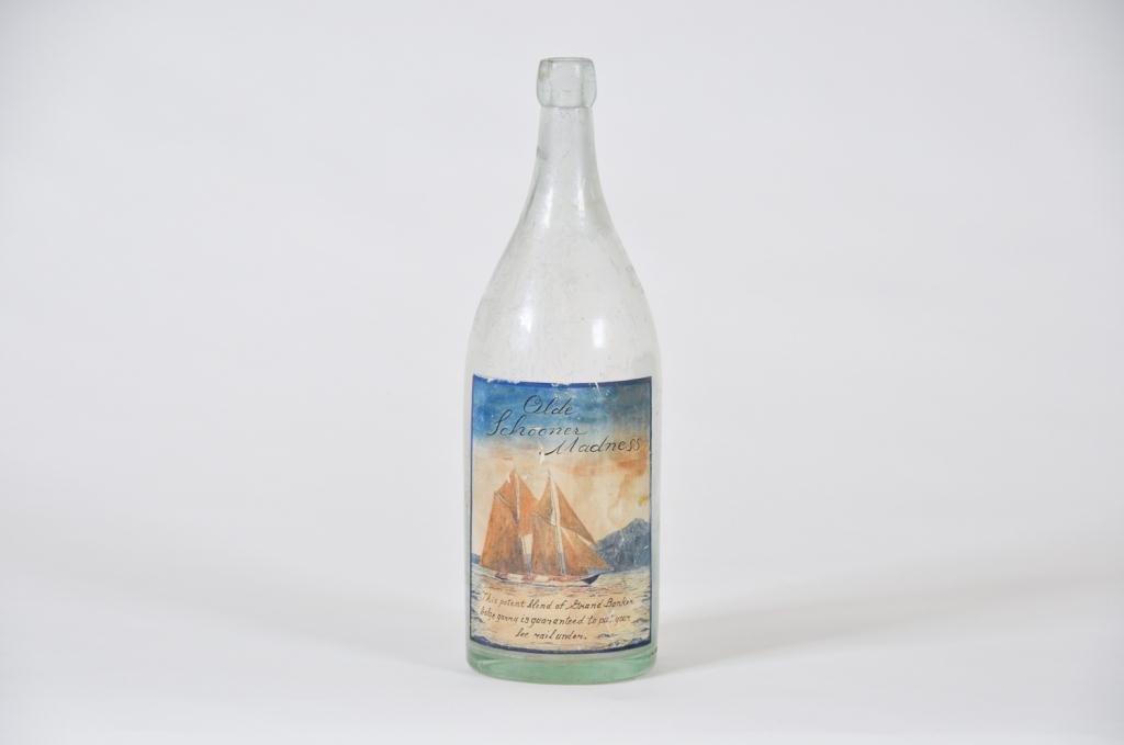 Early American Bottle w/ Hand Painted Label: Early American bottle with hand painted label signed with monogram for John Hutchinson Condition: good Size: 13 7/8" h.good13 7/8" h.