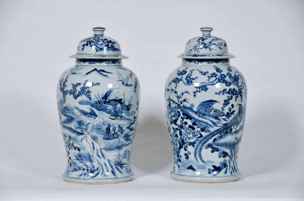 Pair of Chinese Covered Urns: 20th century large pair of Chinese blue & white covered urns decorate with birds and flowering trees Condition: Very good Size: 19" highgood19" high