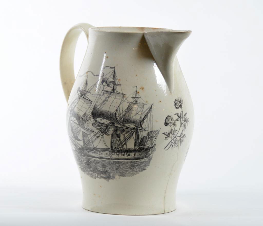 Liverpool Period Cream Ware Pitcher: Decorated on front and reverse with ship under full sail, one side with sailors on board, sailors face and navel weapons; the other side ship empty with cannons out. Condition: large spider on base w