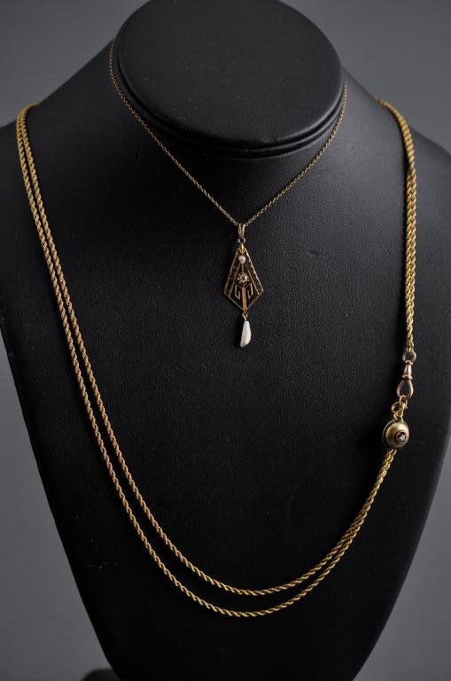 14K Gold Slide Chain with 14K Gold Lavaliere: A long Edwardian period 14K gold slide set with a diamond with a diamond and pearl lavaliere pendant, weight 11 dwt. Condition: good, lavaliere clasp off Size: slide chain 48", pendant 1 5/8" on 14" c
