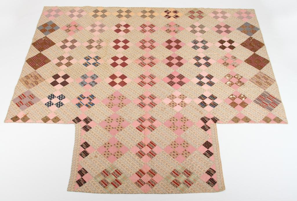 (19th c.) Nine Patch Quilt: Block quilt in pinks and browns made for a four post bed Condition: minor staining Size: 103" x 103"minor staining103" x 103"