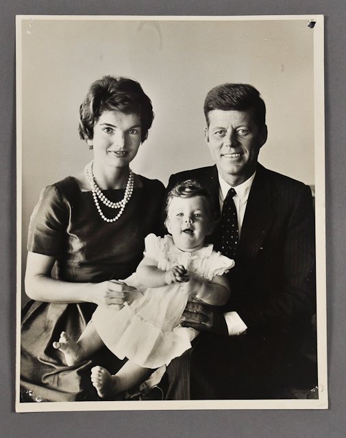 1959-Kennedy Family Portrait: (1) Large format photograph of J.F.K., Jackie and Caroline, stamped "Jacques Lowe" (photographer) verso, 11" x 14". Condition: Tack and staple holes to corners, wrinkles and creases
