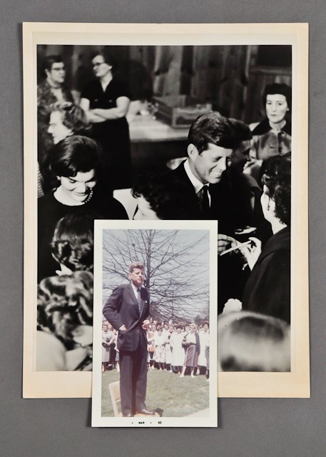 1960-May, J.F.K. Campaigning in West Virginia: (1) Photograph of J.F.K. with Jackie signing autographs at reception, 7 1/2" x 10". Together with a Kennedy '60 PT 109 lapel pin. Condition: Mounted, toning