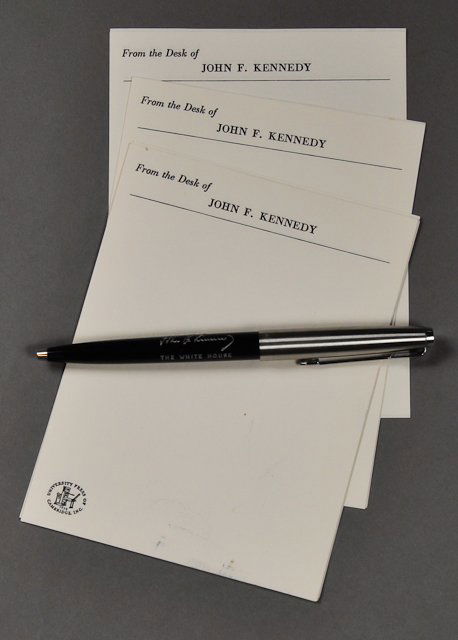 1961-J.F.K. Parker Pen: (1) Retracting Parker ball point pen, inscribed "John F. Kennedy, The White House". Together with (10) sheets of J.F.K. memo paper. Condition: Pen's retraction needs adjusting.
