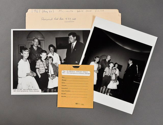 1961-Aug, J.F.K. at the White House: (2) Photographs and negative of the Sprayberry family of Rome, Georgia, who were the one millionth visitor to the White House on August 21, 1961, 8" x 10" each. (1) Color print of the White House in t