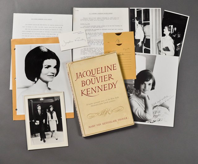 1961- Jackie Kennedy Biographical Material: (1) Jacqueline Bouvier Kennedy, biography by Mary Thayer, 1961. Toning, soiling, abrasions. (3) Typed pages "Dave Powers remembers Jackie Kennedy." (2) Photographs of Jackie, 10" x 4", taken by Harcou