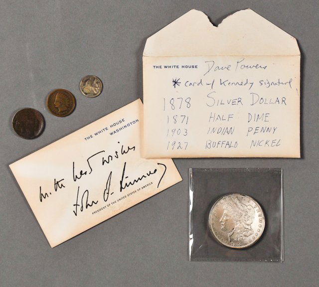 1963-April, J.F.K., Coins: Including a 1878 Silver Dollar, 1871 Half Dime, 1903 Indian Head Penny, 1927 Buffalo Nickel. Together with White House calling card, facsimile signed "all the best wishes- John F. Kennedy". Toning, so