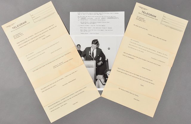 1963-May 29, J.F.K.'s 46th/ Last Birthday: (1) Photograph of J.F.K. at microphone. 8" x 10". (1) Page of Dave Powers typewritten notes on the surprise birthday party. (10) Well-wishing joke telegrams wishing J.F.K. a happy 46th birthday as see