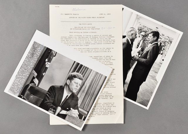 1963-June 13, J.F.K., Television Broadcast: (4) Page press release of remarks of J.F.K. on national television. Toning. (1) Photograph of J.F.K. on television addressing the nation on June 13. 8" x 10". Soiling. Pen marks on text. Taken by the