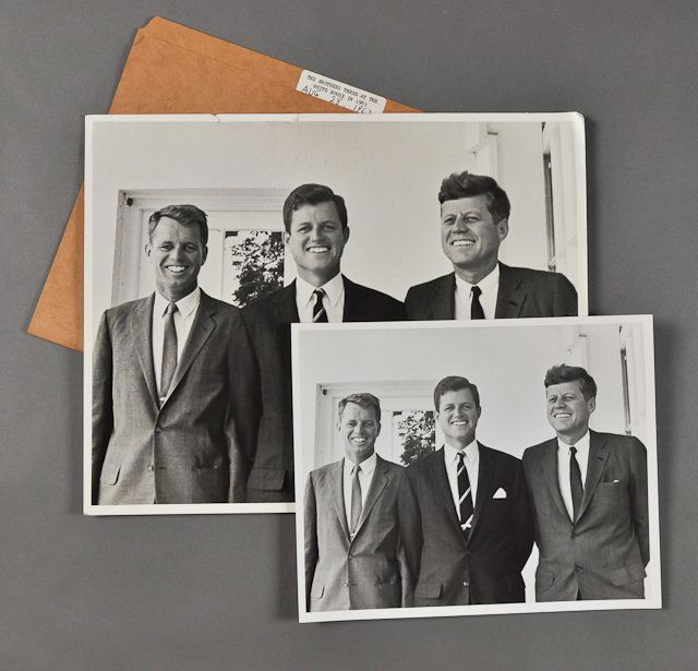 1963-Aug 28, J.F.K., with Brothers: (1) Large Format Photograph of J.F.K. with Bobby and Ted at the White House. 11" x 14". Tears and creasing, folds along top edge. Bends to corners. Taken by Cecil Stoughton. (1) Photograph of the abov