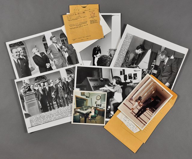 1963-Oct 9-12, Astronaut, Fitness Photos: (1) Color photograph , later reprint, of J.F.K. walking with John, Jr. 7" x 5". Taken by Cecil Stoughton. (1) Color photograph of John, Jr. in the Signal Corps Office. 5" x 5". Fading. (3) Photographs