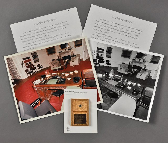 1963-J.F.K., Desk and Office: (1) Page typed Dave Powers recollection "As I Remember President Kennedy". (2) Photographs (1) Color of J.F.K.'s desk. 8" x 10". Taken by Cecil Stoughton. (1) Desk top novelty that appears in the phot