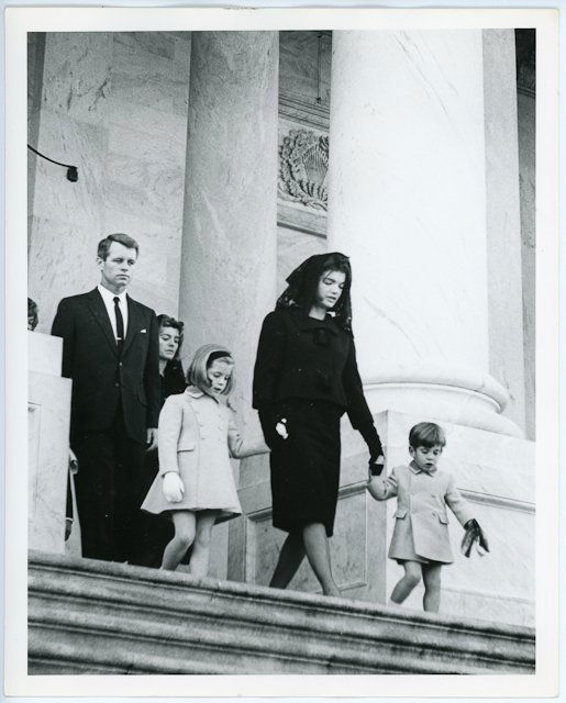 1963-Nov 24, Family Funeral Procession: (1) Photograph of Bobby, Jackie and children walking to J.F.K.'s funeral procession. 8" x 10:. Taken by Abbie Rowe. (1) Photograph of Jackie at the White House entrance with her children waiting to jo