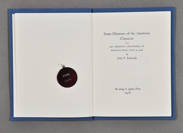 1976-Some Elements of the American Character: (1) Pamphlet, of an Oration Delivered at Faneuil Hall, July 4, 1946 by J.F.K.. A 1976 reprint. 17 pp. 350 copies published. (1) Chrome commemorative pendent "Kennedy Congress 1946-1976". 1" diameter. 