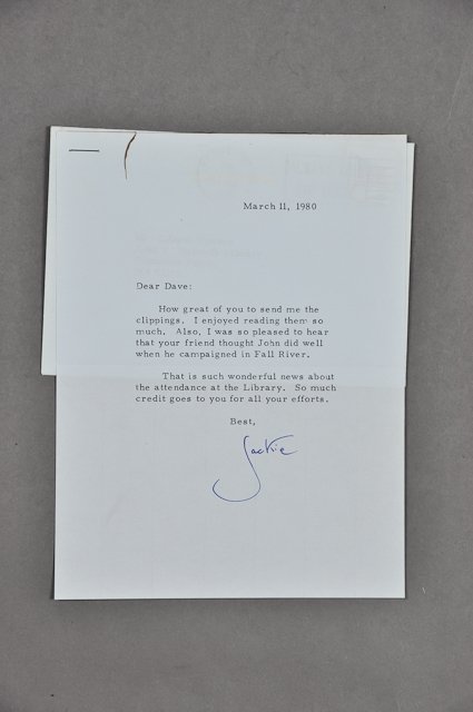 1980-March 11, Note Signed Jackie: (1) Page note with envelope to Dave Powers from Jackie thanking Dave for sending her clippings about the library. Mar 11. Signed Jackie. Condition: Stain at top edge, staple