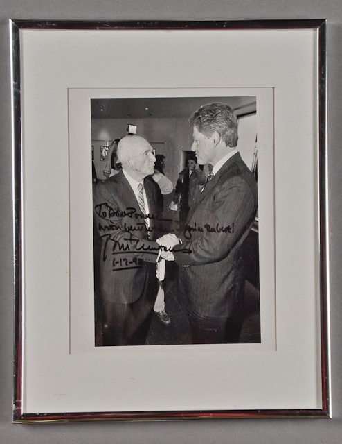 1992-Jan 12, Bill Clinton Signed Photograph: (1) Photograph of Dave Powers shaking hands with Bill Clinton. 9" x 6". Framed. Signed "To Dave Powers with best wishes-you're the best~Bill Clinton 1-12-92" Condition: Foxing, not examined out of fra