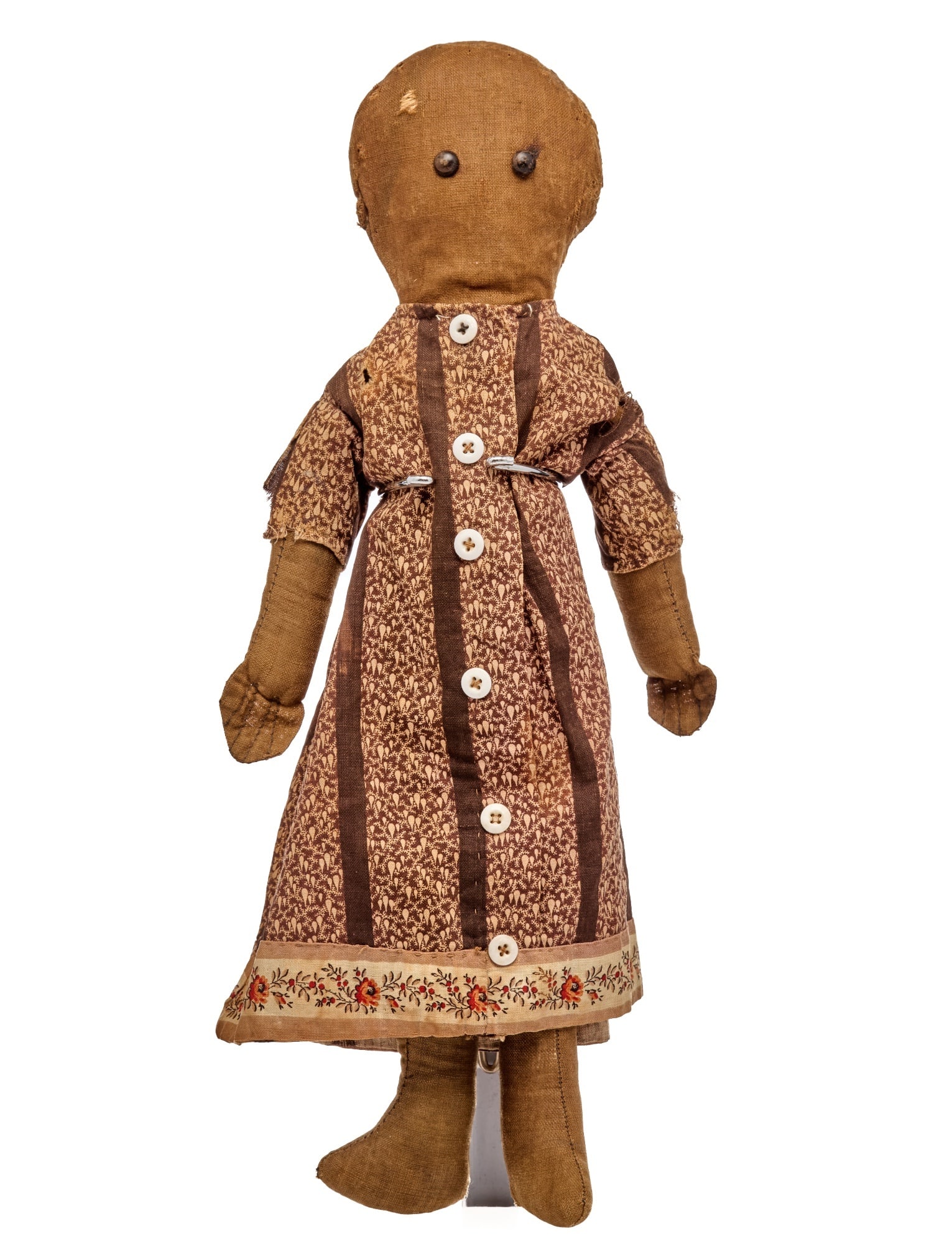 14 IN BLACK CLOTH DOLL WITH CALICO DRESS: A quiet doll with shoe button eyes, lollypop shaped head and sweet little body. She has stitched defined fingers and a interesting way that the maker sewed the hips so she could sit easily. The dress 