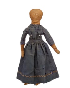 14 IN  DOLL WEARING A VERY EARLY DRESS