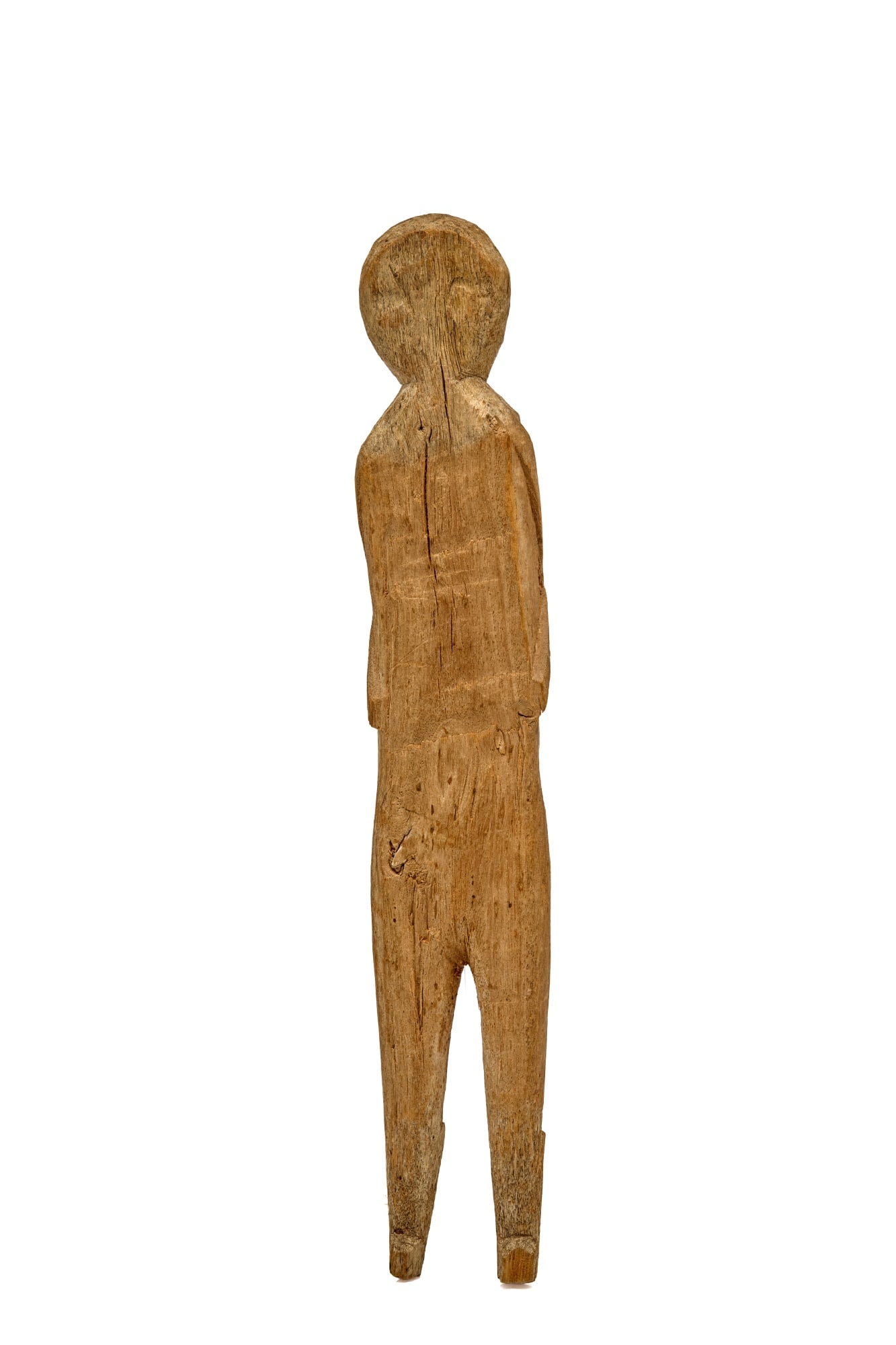 8 1/2 INCH CARVED WOOD DOLL C 1830 with SOME PAINT: Carved wooden doll circa 1830, 8 1/2 inches, a hint of white paint. Very nicely carved with defined arms at her sides and shapely legs with boots and tiny feet facing forward. Her face is faintly seen