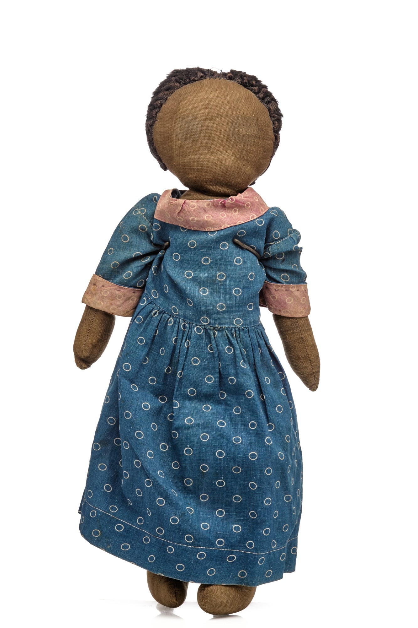 SWEET 18 INCH MAINE BLACK DOLL CIRCA 1910: Sweet antique black doll from Maine no pretense just nice 18 inches. She has a blank face and doesn't look like she ever had features. Her hair is mohair but most of the hair is gone, although some st
