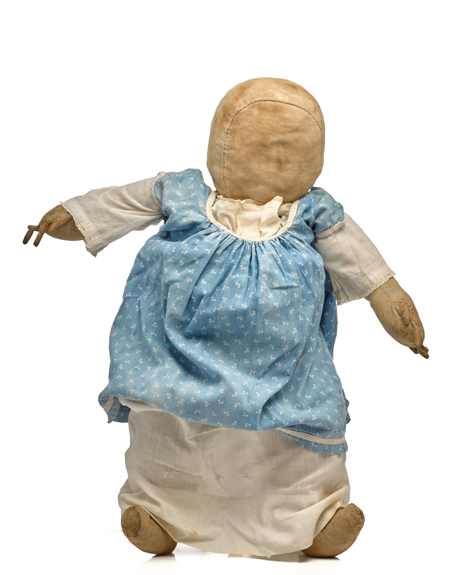 21 IN BIG BABY IN BLUE CALICO DRESS: This blank face doll in a blue calico dress, uniquely wearing a white baby dress under the dress. Can’t explain that one. She is an Amish or Mennonite doll with nice hands and fingers. She is bi