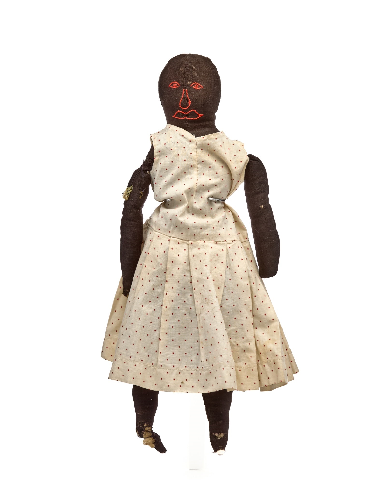 16IN POLKA DOT DRESS BLACK DOLL: What this doll needs is a big hat with a beautiful flowers to make her look and feel happy. She has a great embroidered face, but I bet the seamstress that made her didn’t realize that she turne
