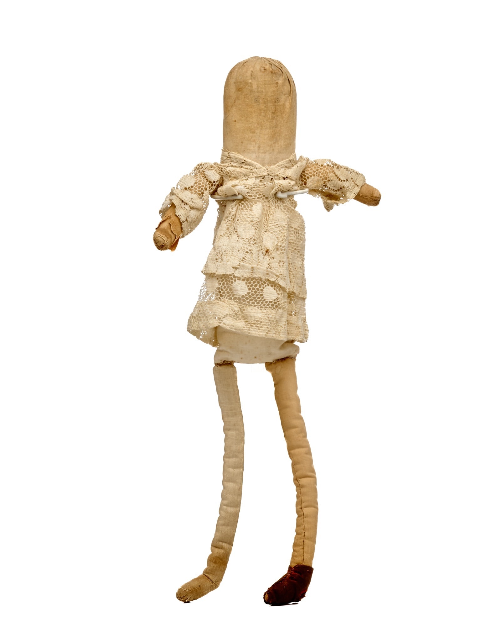 19 IN. ANTIQUE ROLLED DOLL: Simple rolled doll with pencil face, interesting legs, and little lacy top on her. She is, as found. An early dress will make a big improvement on the old doll. Circa 1880-90. Temp No 953