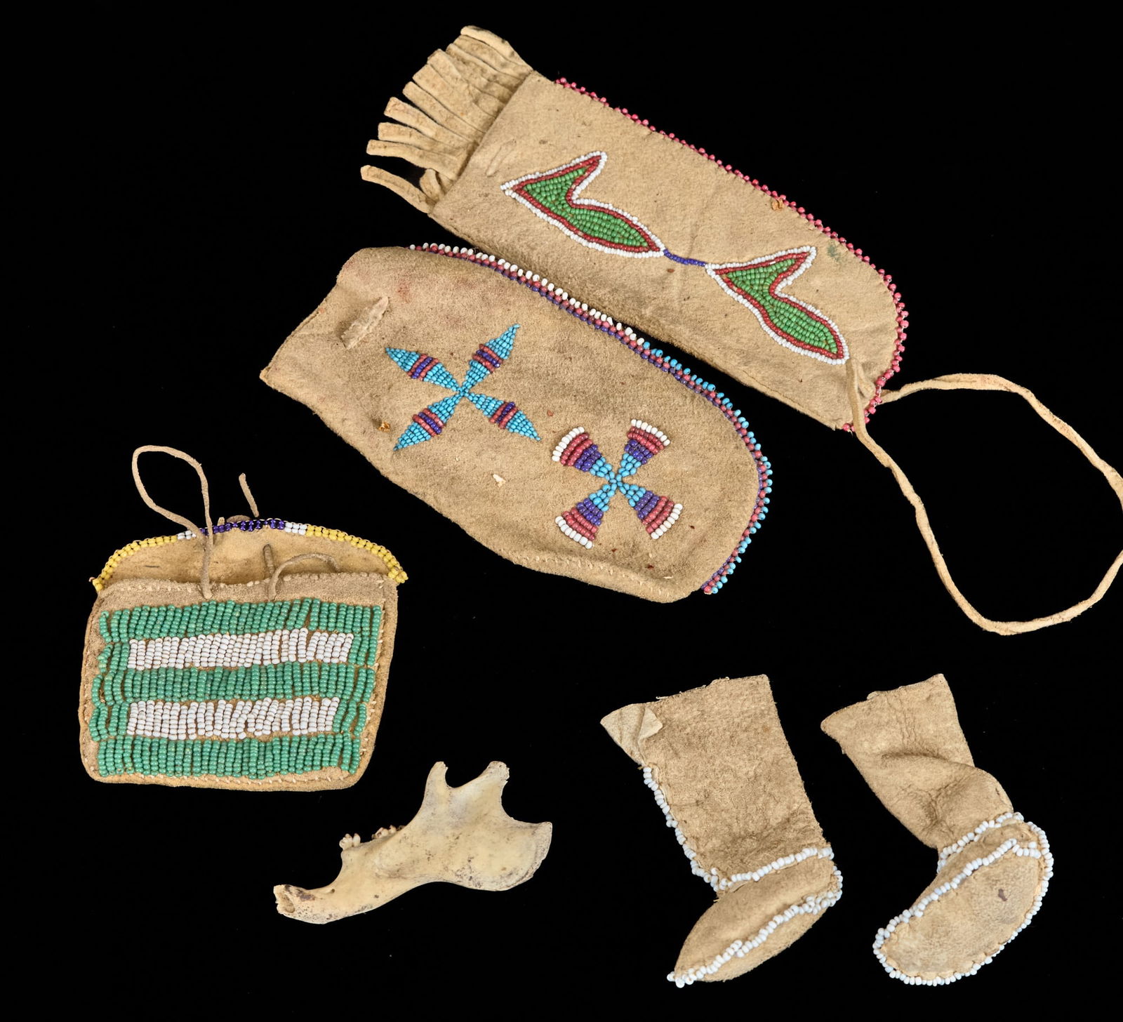 NATIVE AMERICAN BEADED POUCHES and DOLL SHOES: Together with a jaw bone of a small animal. 6 inches (and smaller). Provenance: by direct descent of the family of George M. Dallas, Vice President under James K. Polk. Condition: Good Temp No 2526