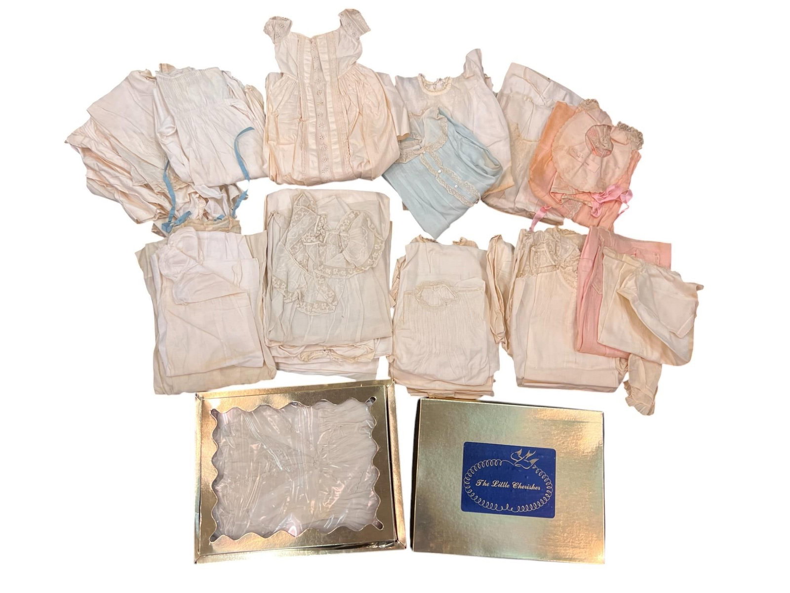 GROUPING OF ANTIQUE/VINTAGE CHILD'S CLOTHING: Including bibs, Christening gowns, dresses, etc. 18 x 19 inches. Provenance: by direct descent of the family of George M. Dallas, Vice President under James K. Polk. Condition: Wear, staining, see pho