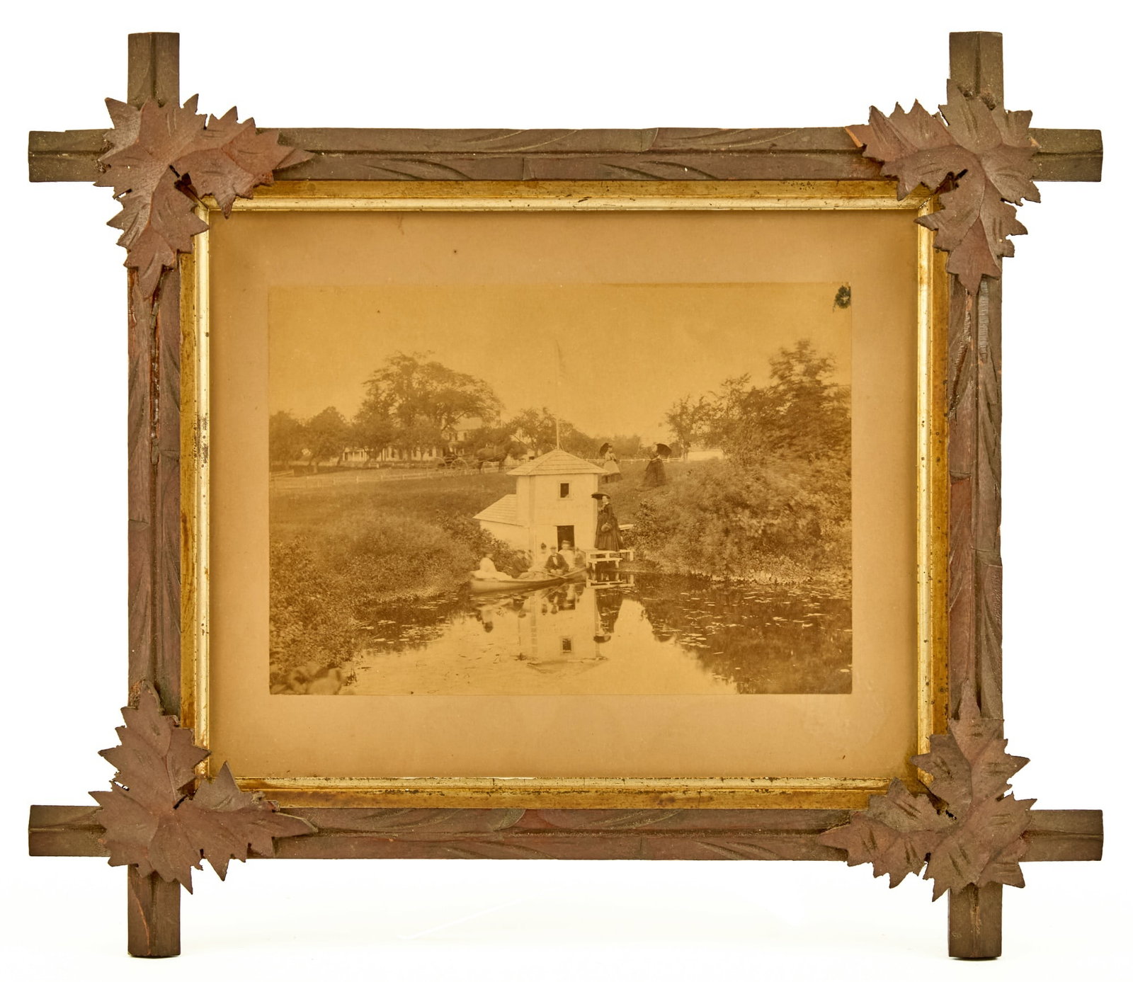 (19th c) PHOTOGRAPH IN BLACK FOREST OAK FRAME: Most likely a photo of the Harding/Eaton Family at their property in Medway, MA. Frame is 12 1/2 x 14 1/2 inches overall. Provenance: by direct descent of the family of George M. Dallas, Vice Presiden