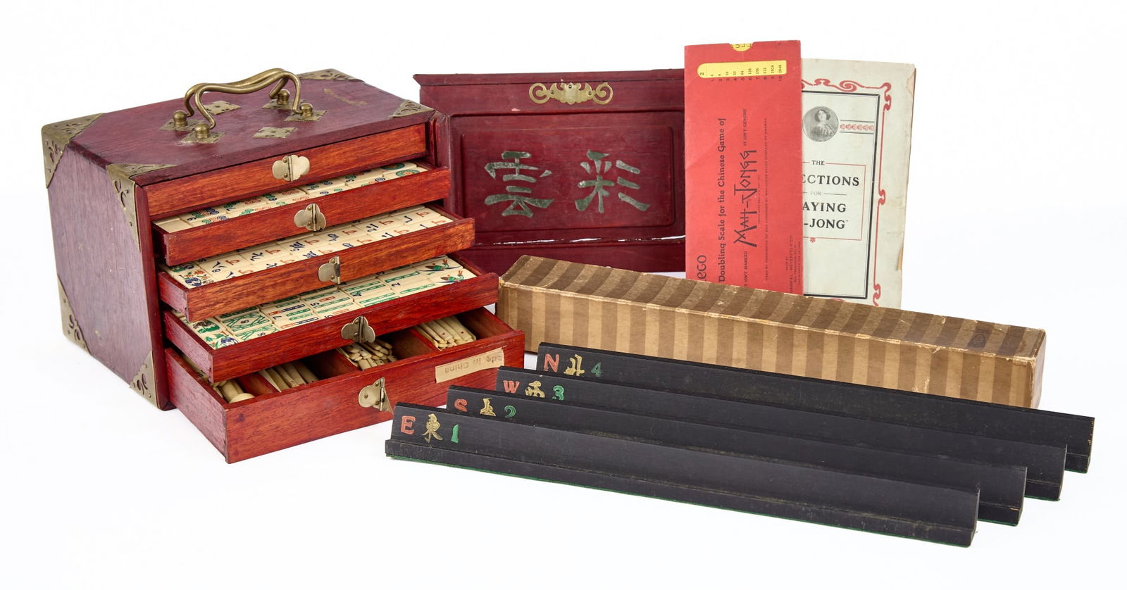 ANTIQUE BRASS BOUND MA-JONG SET: Fine quality bone and bamboo pieces. Complete with instructions. 7 x 9 1/2 x 6 1/2 inches. Condition: Good. Temp No 2184