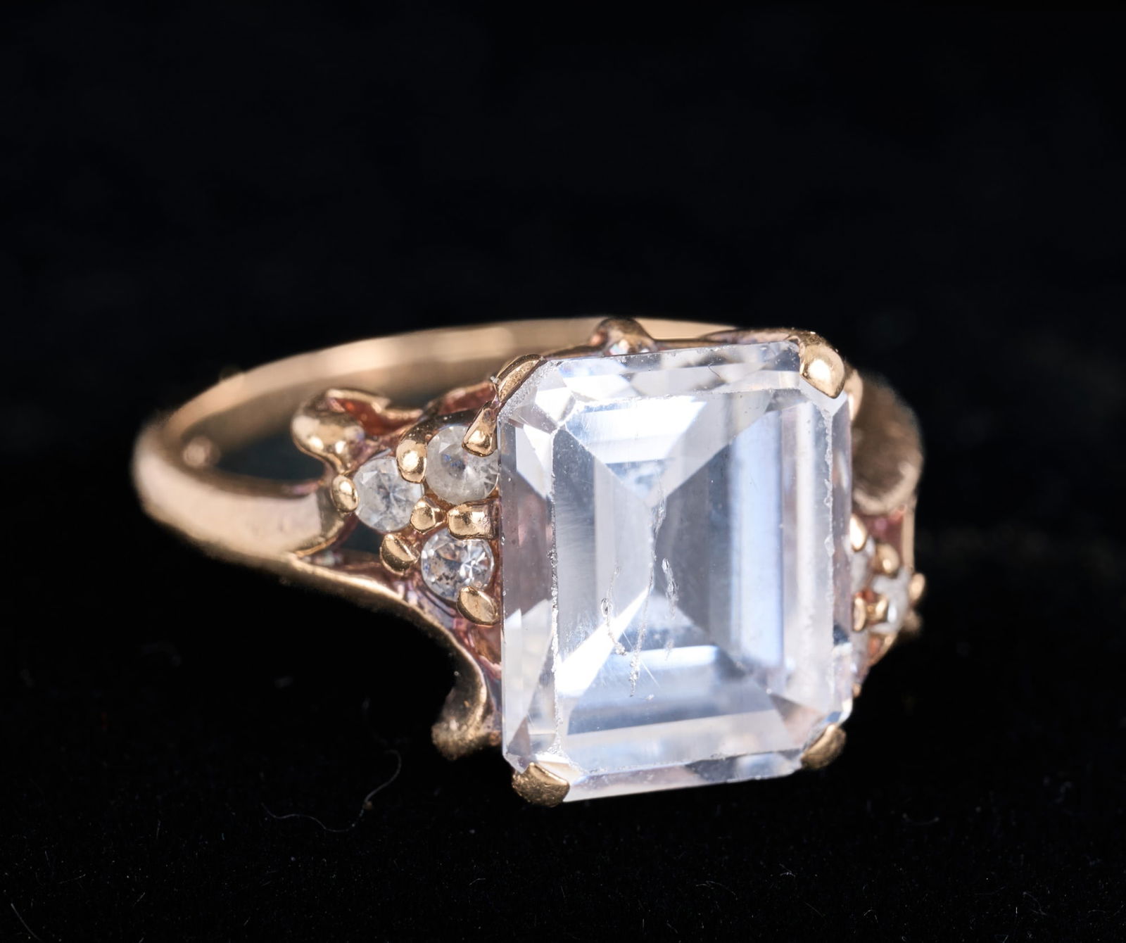 10k GOLD RING set with WHITE TOPAZ: Marked 10k. Size 5 1/4. 1.9 dwt gross weight. Condition: Diamond slightly loose from broken stay, marked 10k. Temp No 3022