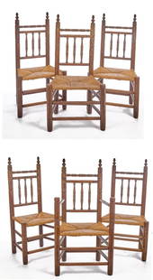 SET of (6) CARVER STYLE GREAT CHAIRS: Possibly by Wallace Nutting. (1) Armchair and (5) side chairs. Acorn finials, spool turned crest rails, rush seats and double stretchers. 47 x 24 x 18 inches. Condition: Finish wear. Temp No 2694