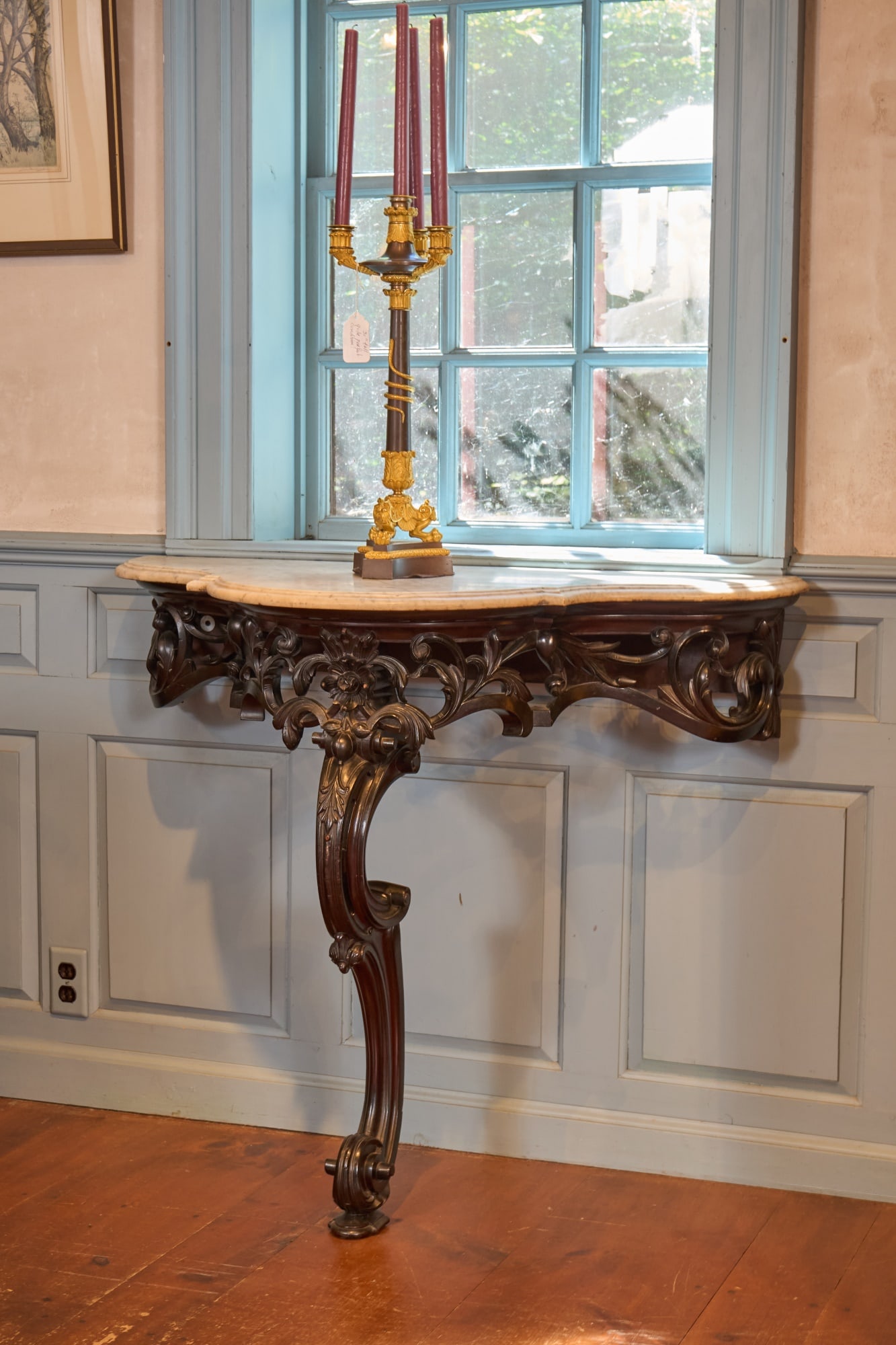 PAIR of MID (19th c) ANGLO-INDIAN CONSOLE TABLES: Ebonized mahogany with the original shaped and molded marble tops. Great carving that retains all original detailing. Provenance: This pair originated from Kolkata, Calcutta. Temp No 9029
