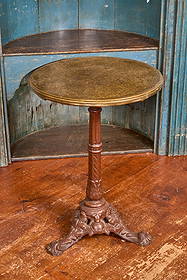 MID (19th c) FRENCH PUB TABLE on CAST IRON BASE: Top made of unknown pressed material (possibly a leather) secured with brass rim on painted cast iron base. 28 x 20 x 20 inches. Condition: Good. Temp No 9073