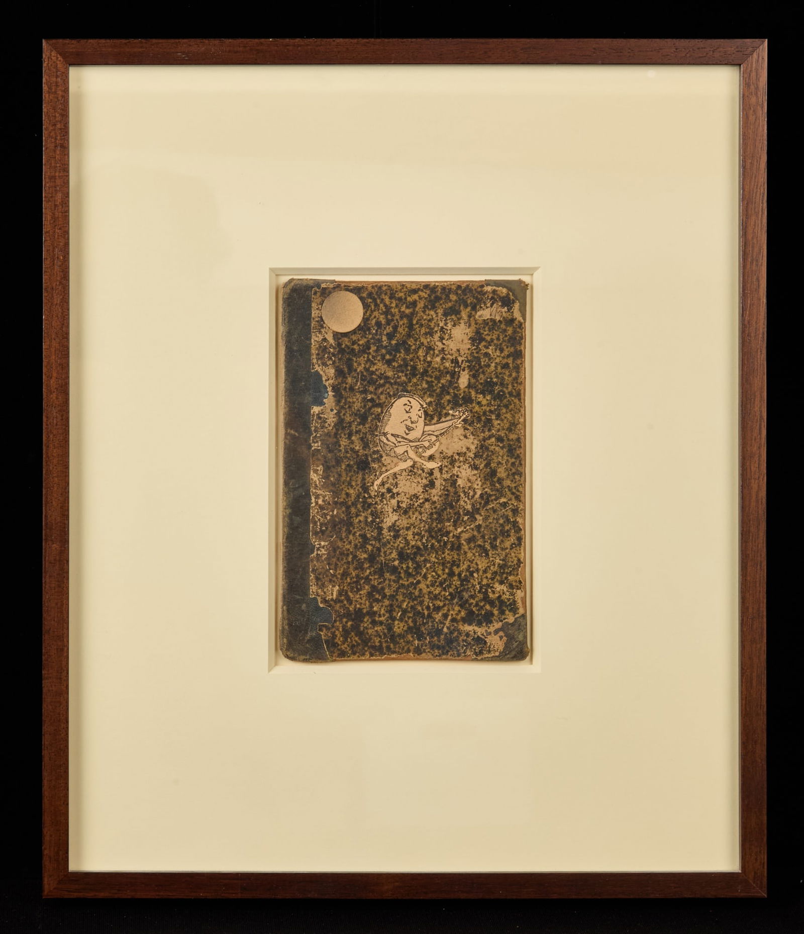 HUMPTY with MANDOLINE by ROBERT ESHOO (1926-2018): Assemblage cut paper on antique book cover. 7 x 4 1/4 inches. unsigned, untitled, framed 16 x 13 1/2 inches Condition: Good Temp No 7316