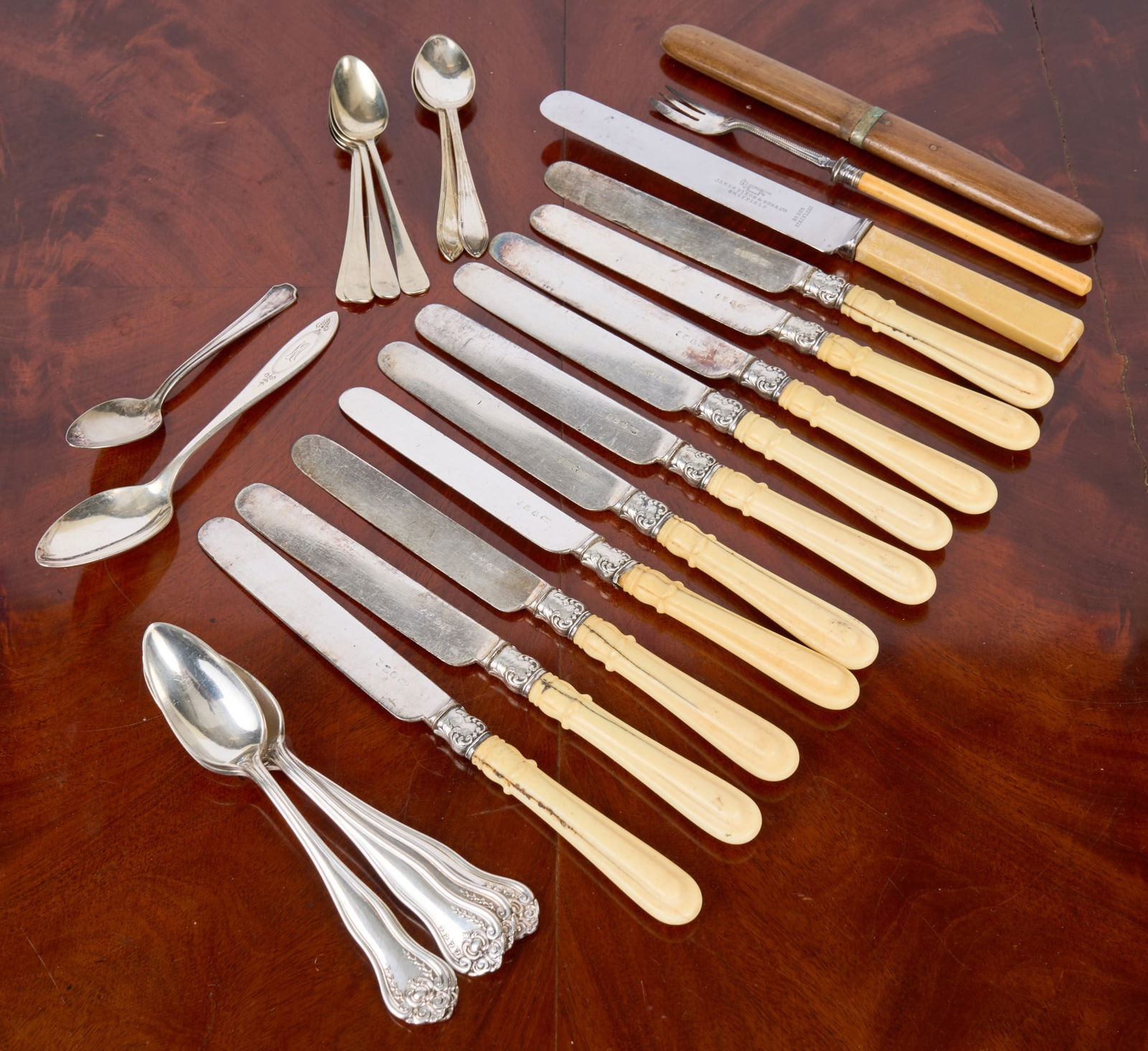 GROUPING of PAIRPOINT SPOONS, DEMI TASSE & KNIVES: Knives by S.H. & Co. St. Louis, Missouri together with silver plated spoons etc. Condition: Good to fair Temp No 7021s
