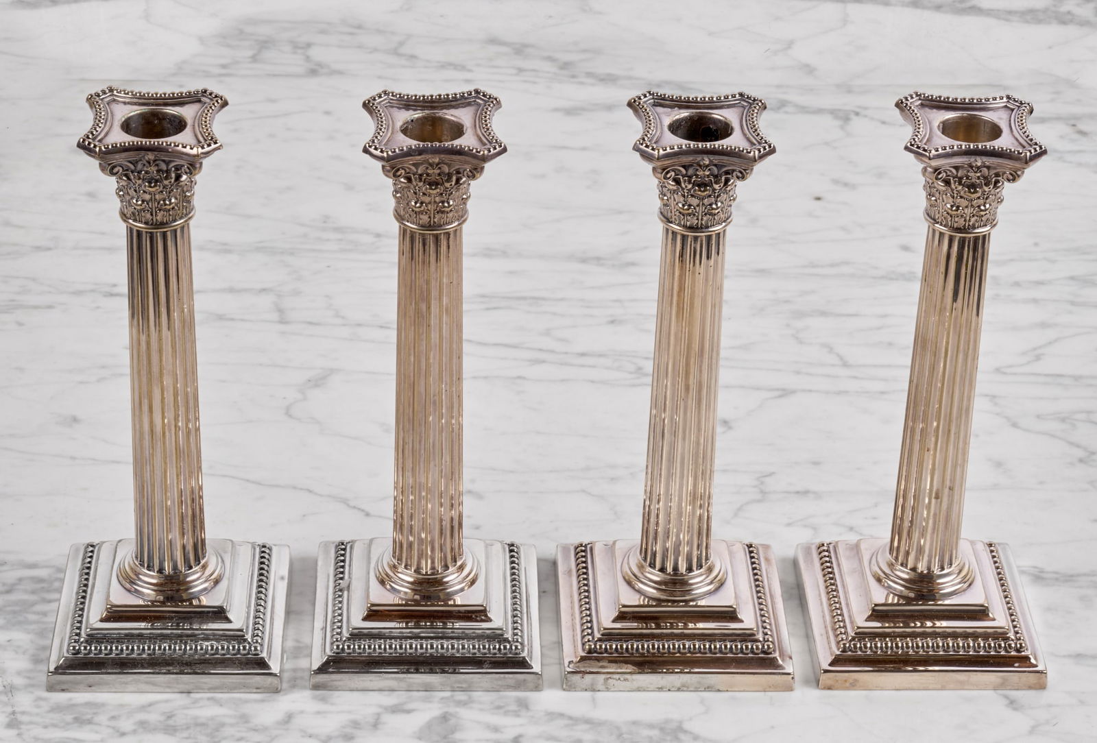 SET of (4) GORHAM MFG. SILVERPLATED CANDLESTICKS: Corinthian column-form with square bases. 8.5 inches Condition: Good Temp No 7672