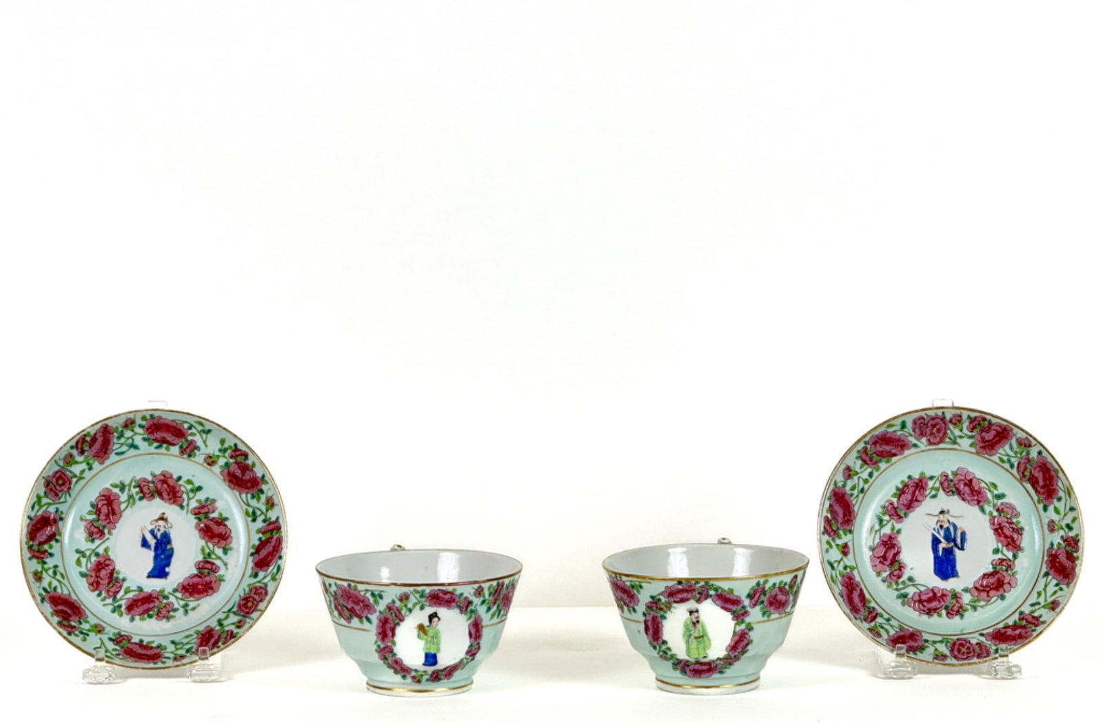 PAIR FAMILLE ROSE TEACUP & SAUCER: With center Scholar decoration. Saucer measures 6 inches.