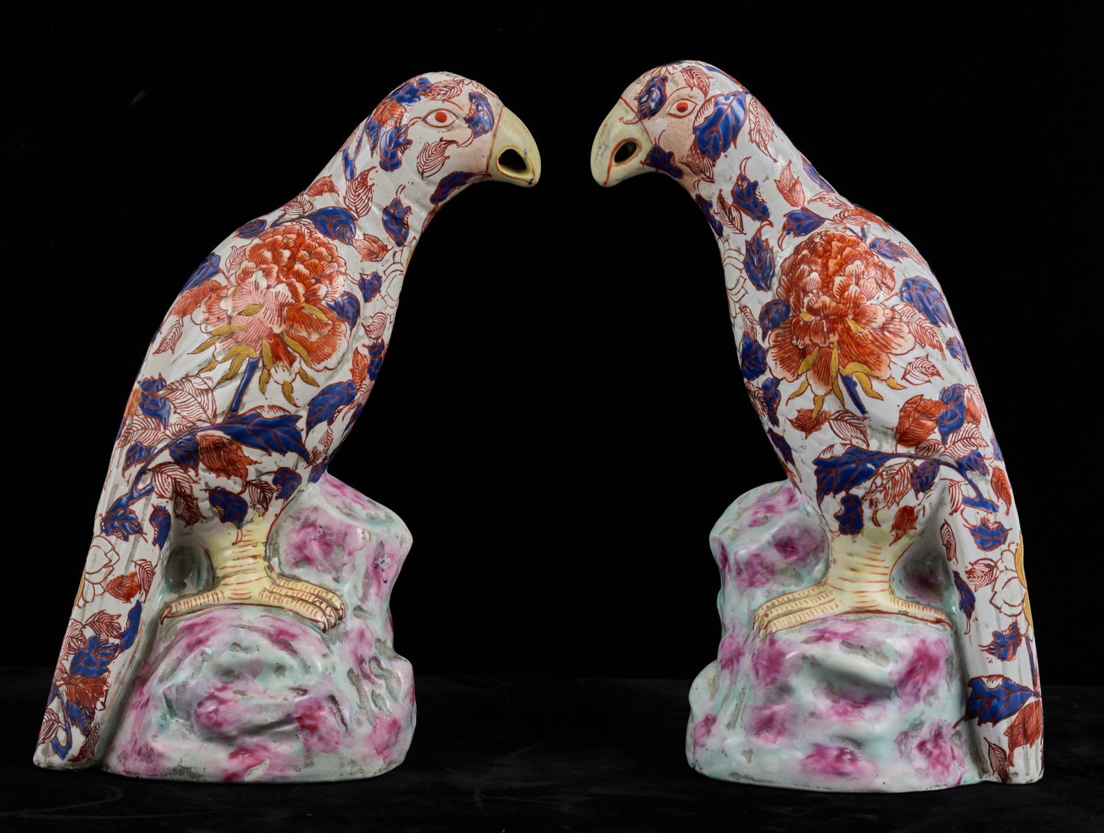 PAIR OF QING DYNASTY CHINESE PORCELIAN PARROTS: Each perching parrot is decorated in a pattern of leaves and flowers. signed under base. 10 inches Condition: Good Temp No 7036as