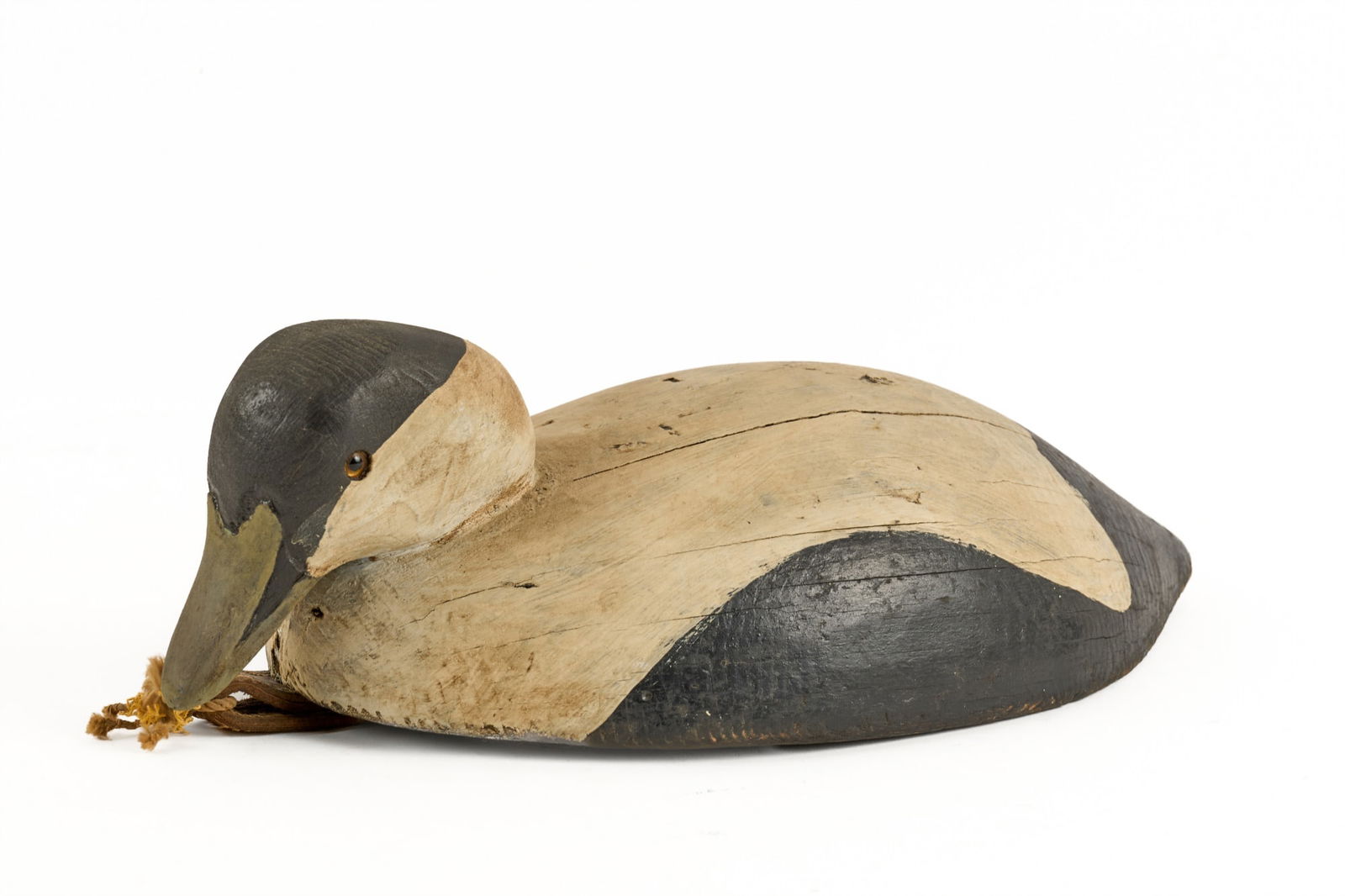 CARVED and PAINTED DECOY of a SWIMMING EIDER (1 of 7)